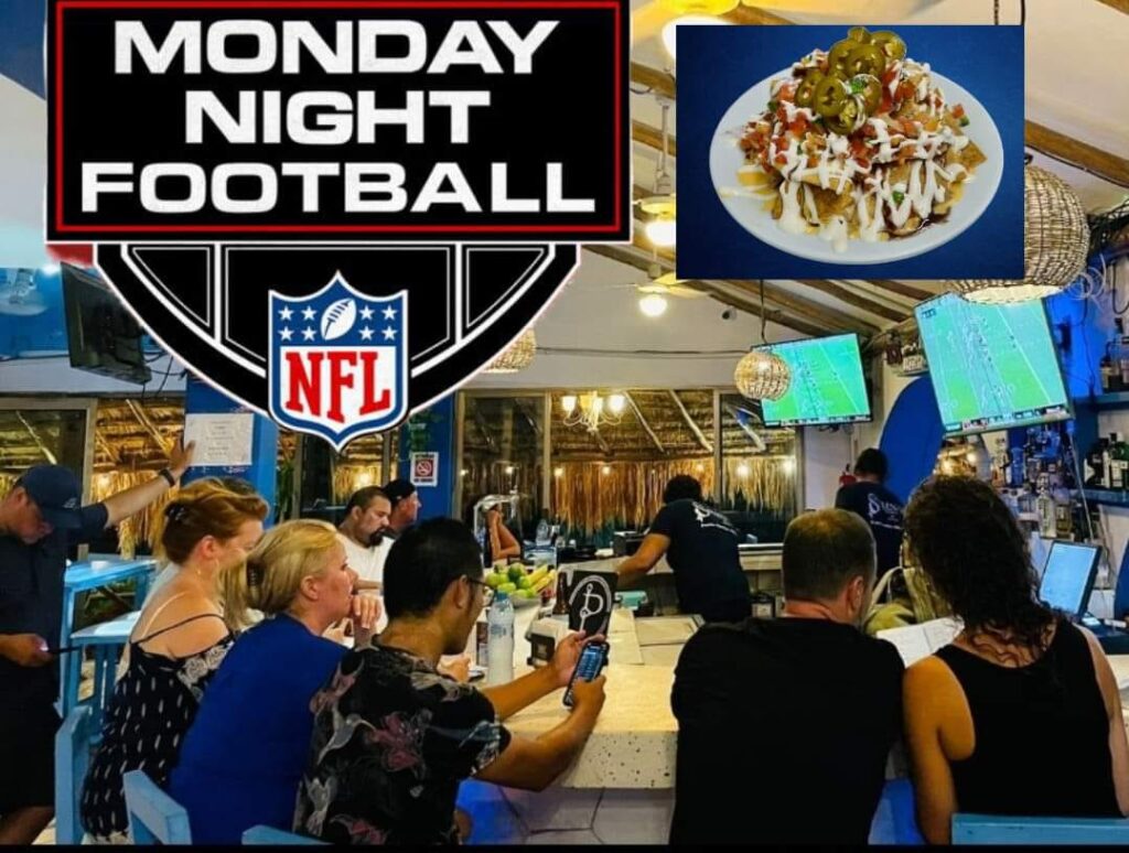 Image of a group of people around the bar on the 2nd floor of La Sirena while watching their Monday Night Football NFL games.