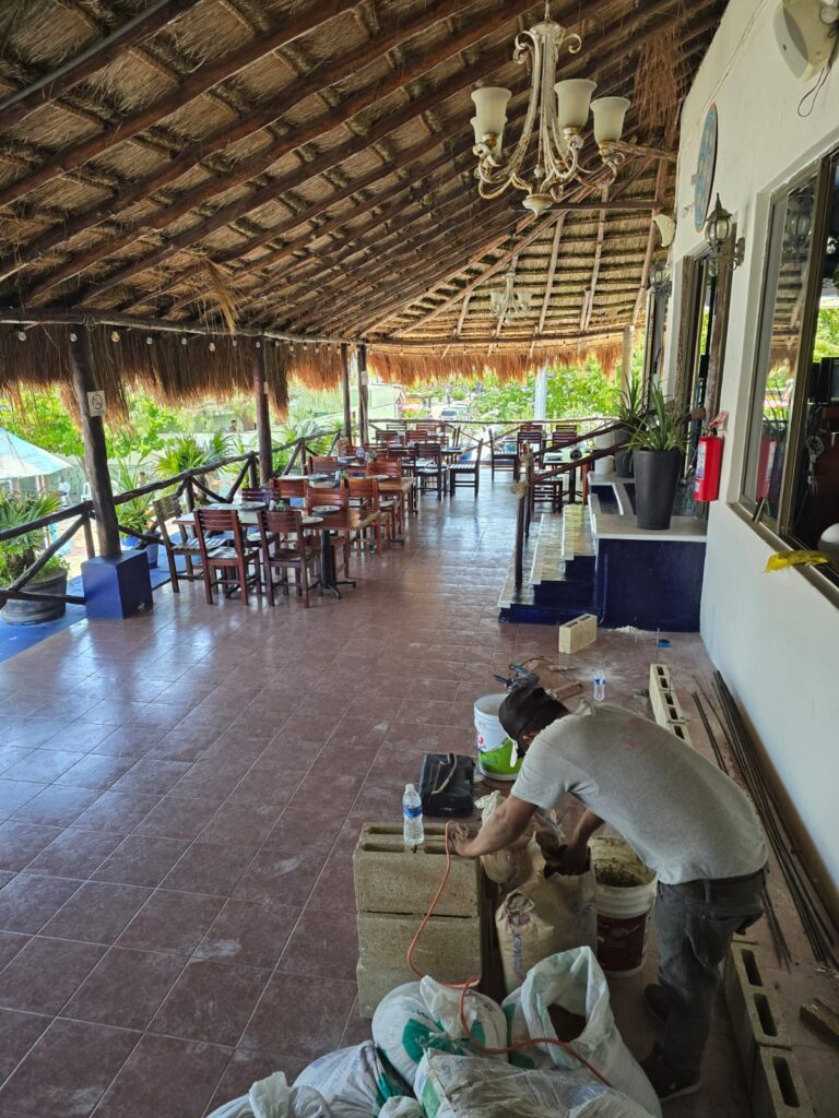 Image of a construction worker from JJ Property Management Services beginning renovations on the second floor of La Sirena Puerto Morelos.